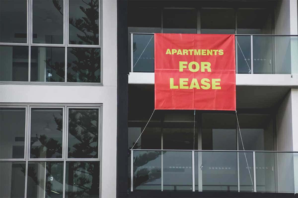 Apartments for lease exterior red banner real estate