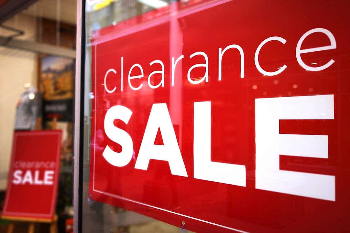 Clearance sale banner on window display of a fashion store
