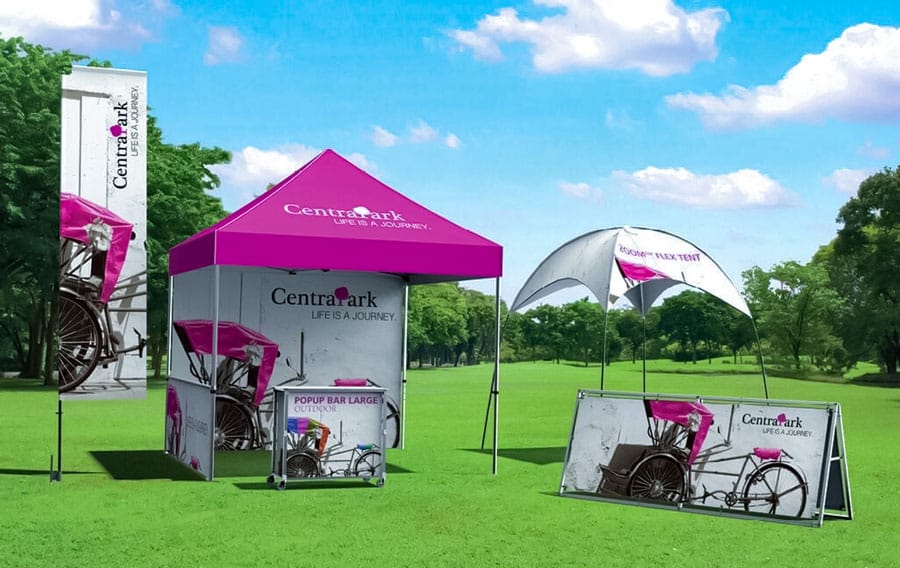 Pink Custom Pop-Up Tents in Grassy Field
